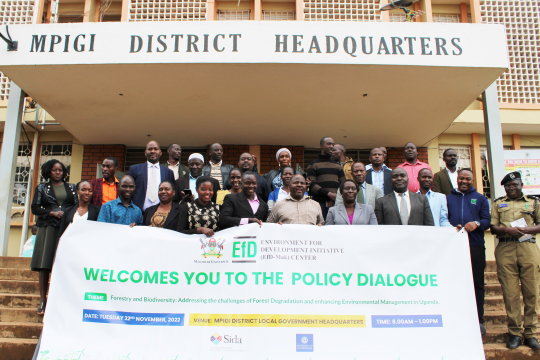 Participants posing for a group photo after the policy dialogue.
