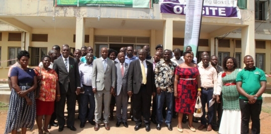 Participants posing for a group photo after the dialogue at Mukono district headquarters